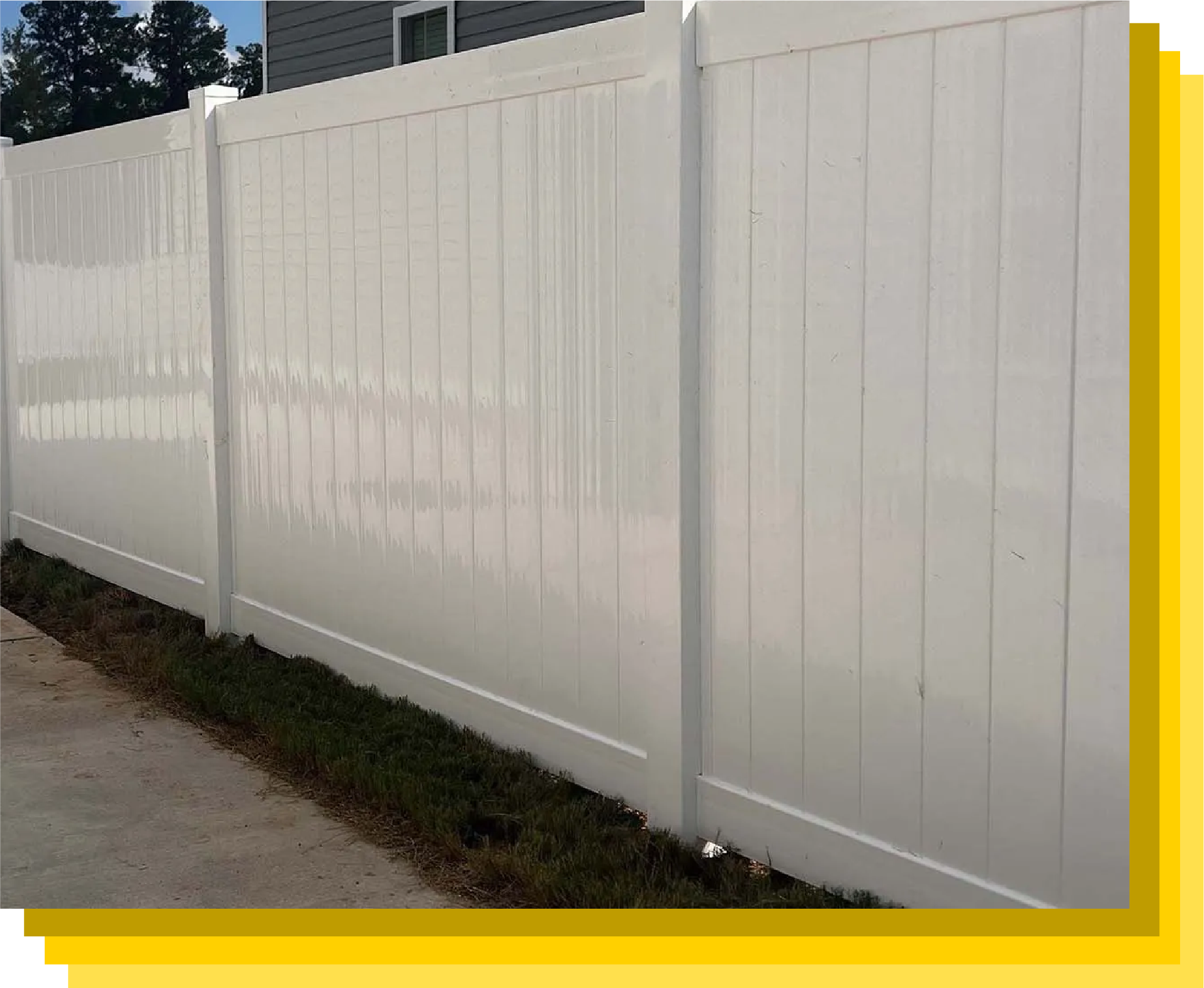 Clean white vinyl fence protecting a modern home