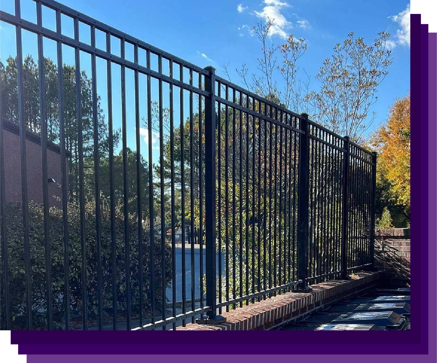 Sleek black aluminum fencing framing a high-end property